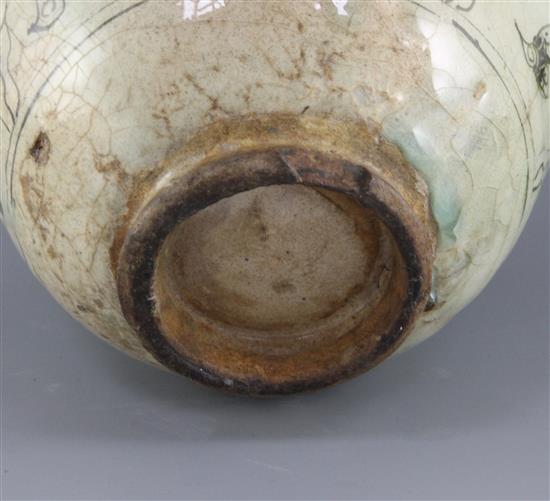 A Kashan pottery ovoid jar, 13th century, height 21.5cm, cracks and losses